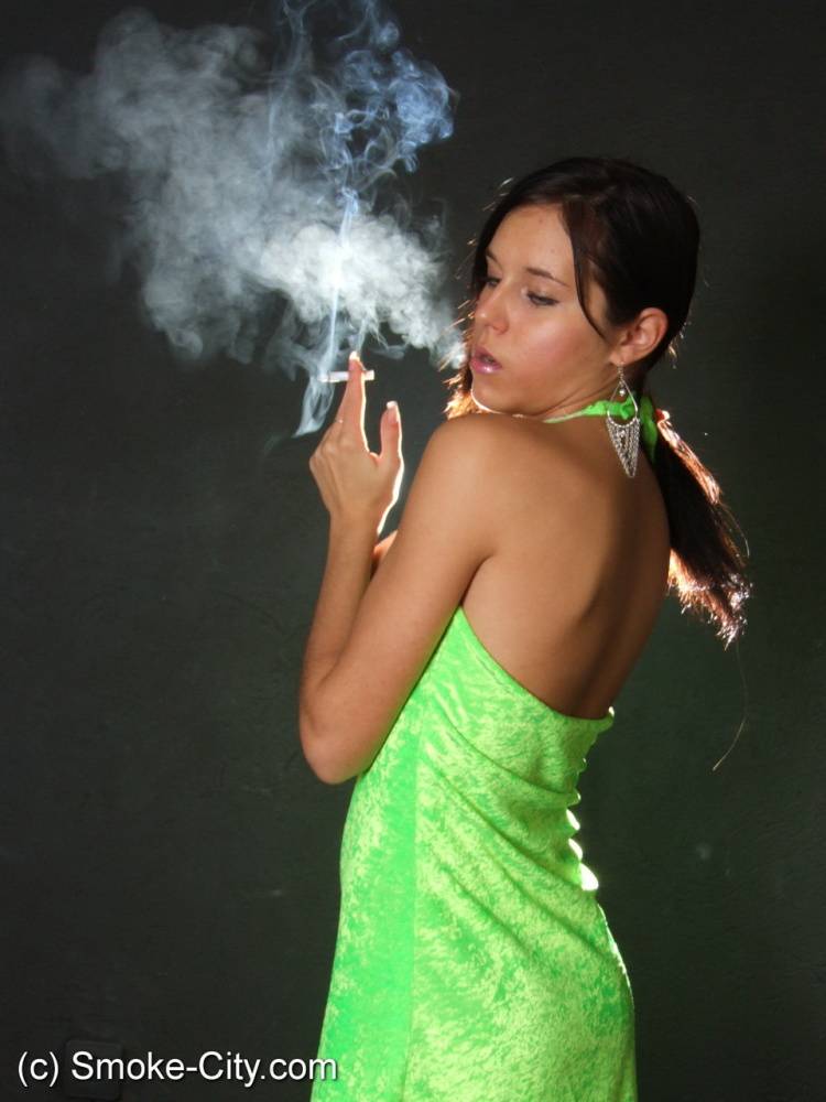 Dark haired teen wears a lime dress and pointy heels while smoking - #14