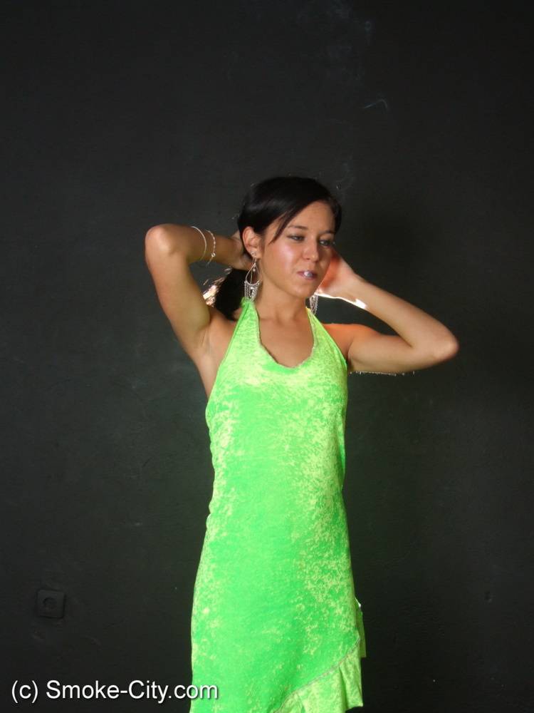 Dark haired teen wears a lime dress and pointy heels while smoking - #8