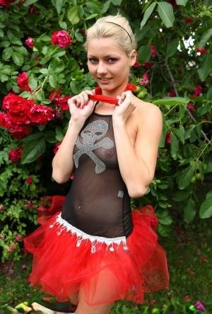 Cute blonde teen Buffy hikes up a tutu before masturbating in the back yard - #main