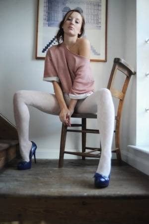 Long legged MILF Sophia Smith peels her white pantyhose to pose topless - #main