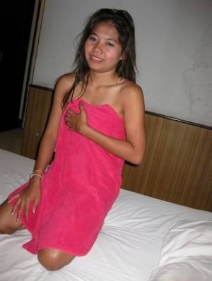 Petite Thai girl washes up her shaved pussy after bareback sex with a tourist - #main