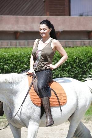 Pornstar Aletta Ocean is riding a horse outdoor in glasses - #main