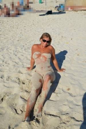 Naked amateur Sweet Susi covers her body in beach sand in sunglasses - #main