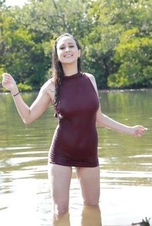 Busty teen chick Ashley Adams masturbating fully clothed beside lake - #main