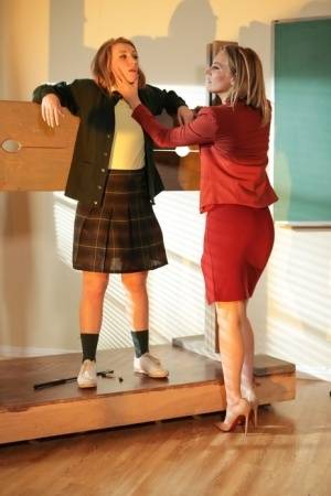 Blonde teacher puts a student into the stocks before lezdom action begins - #main