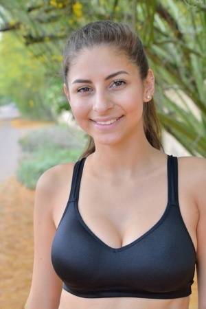 Teen jogger pauses to take off her spandex pants and bra on a run - #main