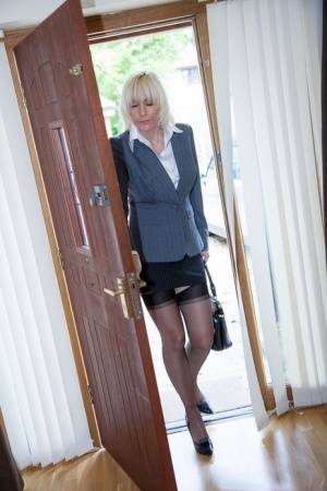 Older MILF Jan Burton strips off business clothes after a hard day at office - #main