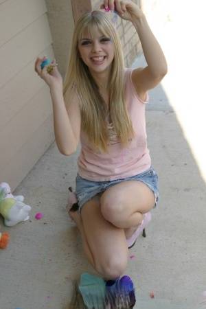Sweet blonde teen Jana Jordan flashes upskirt panties while eating chocolate - #main