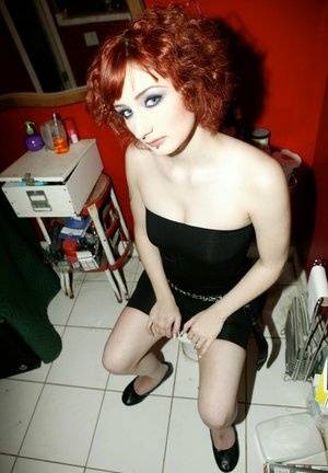 Pale redhead Violet Monroe gets naked in flat shoes while in a bathroom - #main