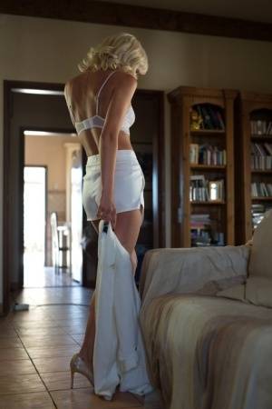 Gorgeous blonde Victoriah works free of all white attire in a sexy manner - #main