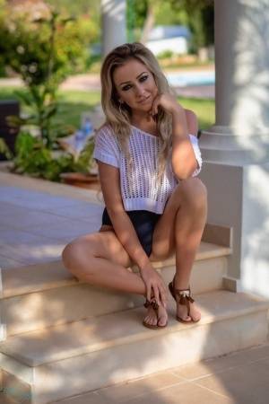 Glamour model Beth Morgan highlights her big natural tits on a porch - #main