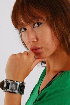 Redheaded Asian girl Evita models a Guess style cuff watch during SFW action - #main