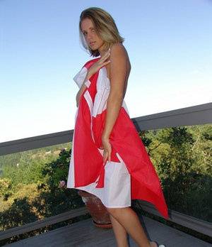 Canadian teen Karen wraps her naked body in a flag on her back deck - #main