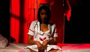 Ebony female Skin Diamond models naughty nurse attire during upskirt action - #main