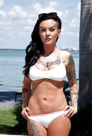 Tattooed whore Lolo Luscious exposing big hooters in swimming pool - #main