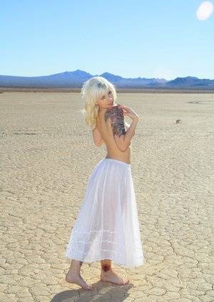 Sexy blonde Lynn Pops goes topless on a dry lake before exposing her vagina - #main