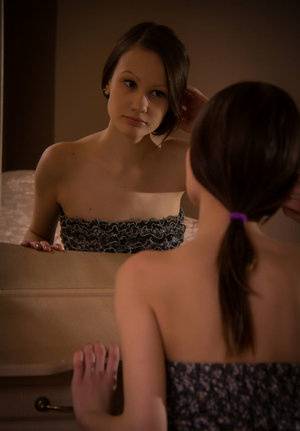 Brunette teen Anna B admires her smooth pussy in bedroom mirror on clubgf.com
