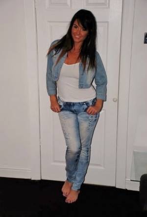 Dark haired teenj frees her bare ass and twat from denim jeans in bare feet on clubgf.com