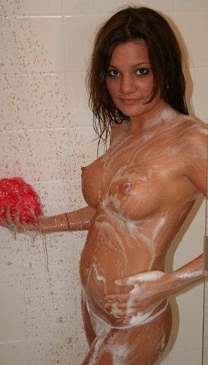 Teen amateur Kate Crush soaps her perky breasts while taking a shower on clubgf.com