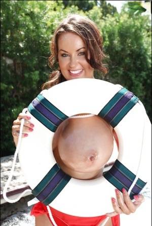 Big tit model Sarah Nicola Randall flaunting her oiled juggs outdoors on clubgf.com