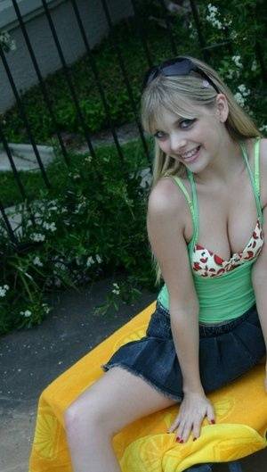 Young blonde Jana Jordan exposes her pretty bra and panties by a swimming pool - Jordan on clubgf.com