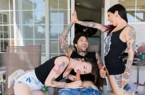 Tattooed dark haired slut in short skirt gives hot handjob during threesome on clubgf.com