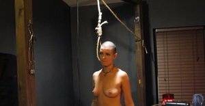 Shaved head slut Abigail Dupree getting tortured in the dungeon on clubgf.com