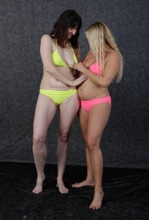 Blonde amateur Sweet Susi and her lesbian friend fondle each other in bikinis on clubgf.com