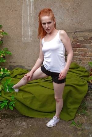 Petite redhead with hairy pussy Tia Jones sexy outdoor solo play on clubgf.com