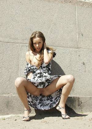 Sweet teen girl Natasha L wears no underwear under her dress outdoors on clubgf.com