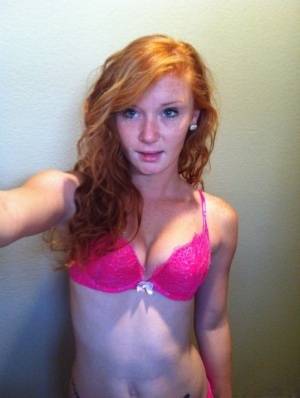 Natural redhead Alex Tanner slips off her pink lingerie set for nude selfies on clubgf.com