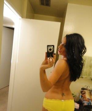 Brunette slut Tiffany Brookes taking mirror self shots while undressing on clubgf.com