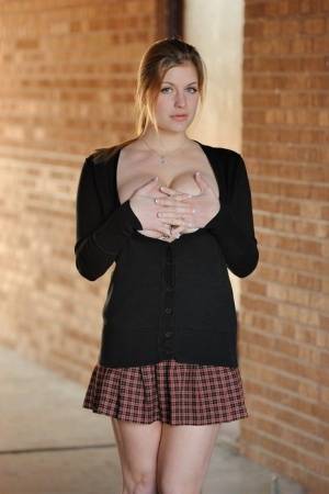 Amateur abbe letting big natural schoolgirl tits loose outdoors in socks on clubgf.com