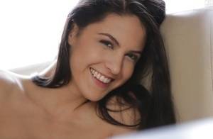 Latina pornstar Carolina Abril strips off her white bra and panties on clubgf.com
