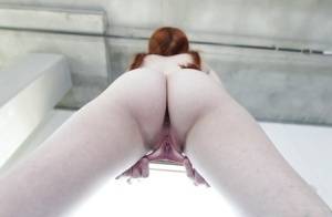 Young redhead Dolly Little revealing shaved pussy in pigtails and socks on clubgf.com