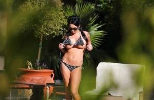Kitty Bella gets caught on a voyeur photo tanning naked outdoor on clubgf.com