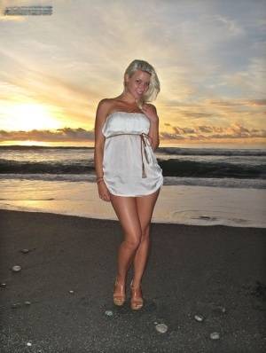 Hot blonde Anikka Albrite strips naked at the beach before nude hitchhiking on clubgf.com