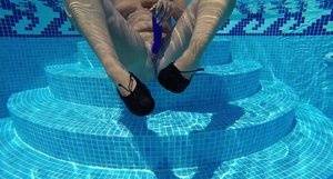 Older blonde Sweet Susi masturbates while mostly underwater in a pool on clubgf.com