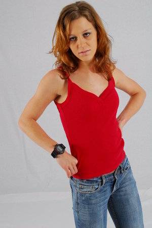 Natural redhead Sabine shows off her black G-shock watch while fully clothed on clubgf.com
