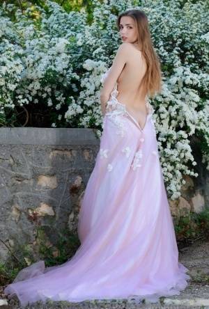 Beautiful girl Elle Tan slips off wedding dress to pose nude in garden on clubgf.com