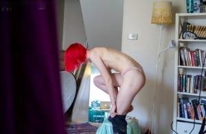 Nude amateur redhead Elizabeth M gets dressed while a hidden spy cam rolls on clubgf.com