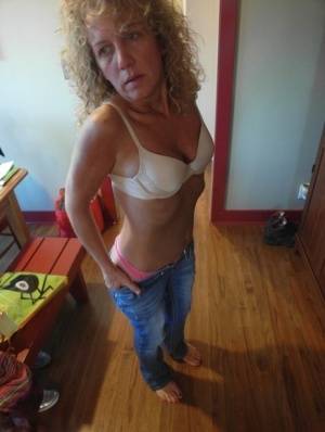 Old woman with curly blonde hair strips before sucking a cock and masturbating on clubgf.com