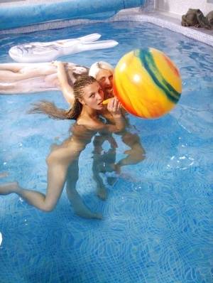 Petite teenage chicks have some lesbian fun using their toys in the pool on clubgf.com