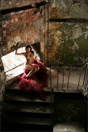 Slim brunette with a great ass models totally naked in deserted building on clubgf.com