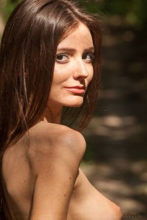 Horny teen Sunshine A stretches in the forest showing her very thin body on clubgf.com