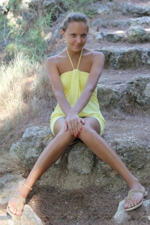 Cute teen Mango A in mini dress spreading outdoors for closeup of bald twat on clubgf.com