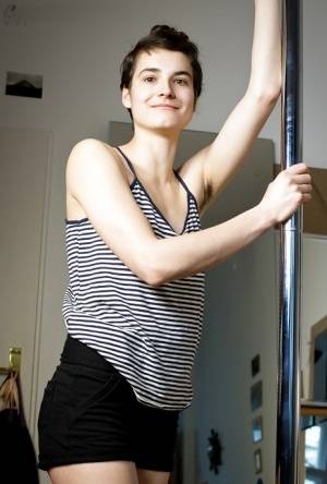 Natural hairy amateur Mayra dancing on a pole and getting naked on clubgf.com
