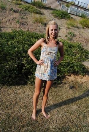 Blond amateur Tiny Tiff removes a summer dress and thong to stand nude outside on clubgf.com