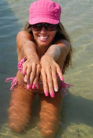 Amateur model Lori Anderson shows her hairy arms while wearing a bikini on clubgf.com
