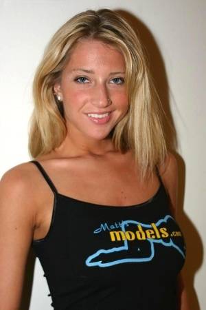 Blonde girl Sammie proudly uncovers her big natural breasts on clubgf.com